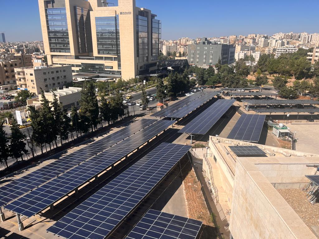 Solar carpark arrays near University of Jordan Hospital buildings