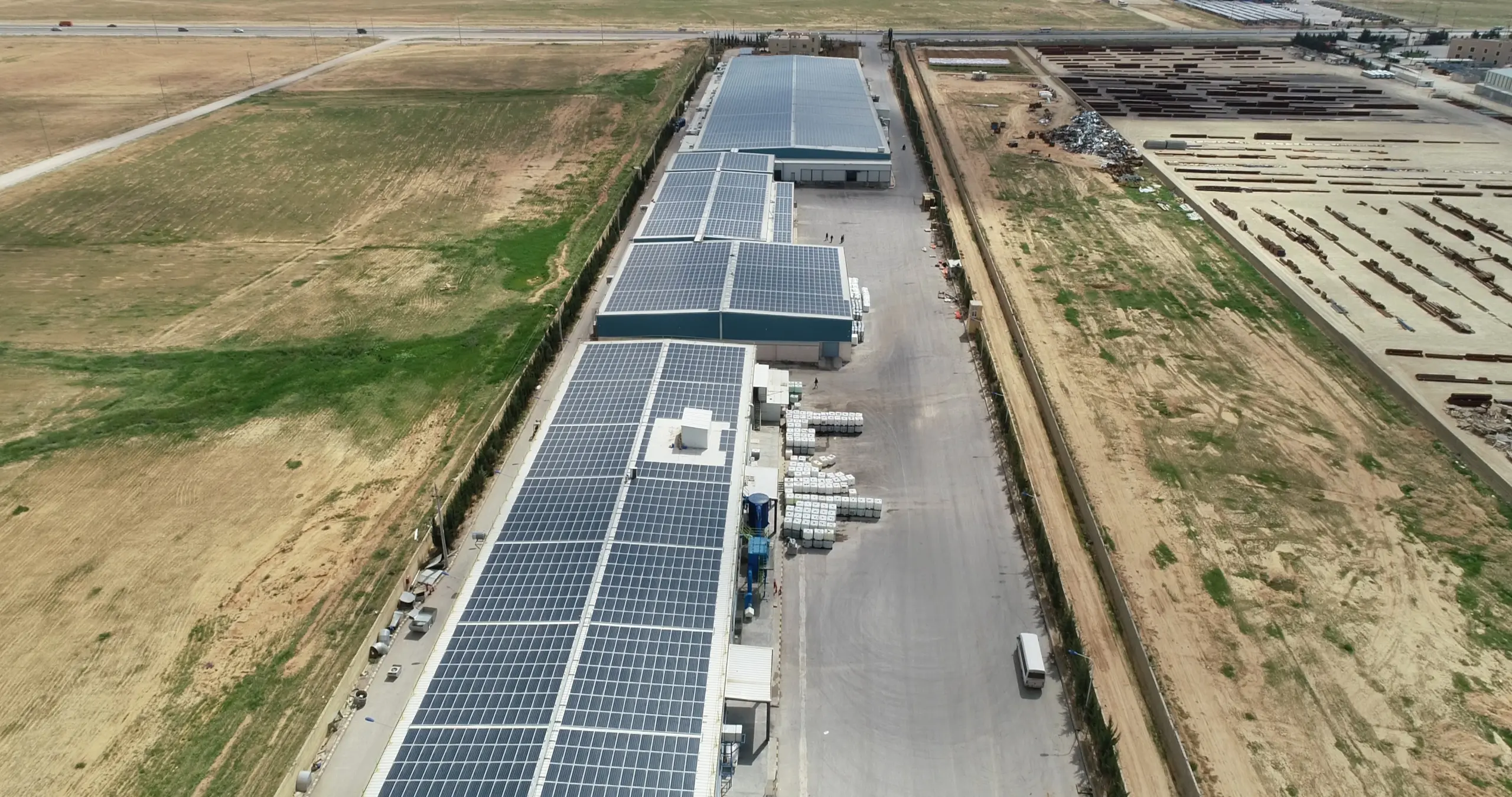 Long rooftop PV rows across Giant Industrial Group factory roof